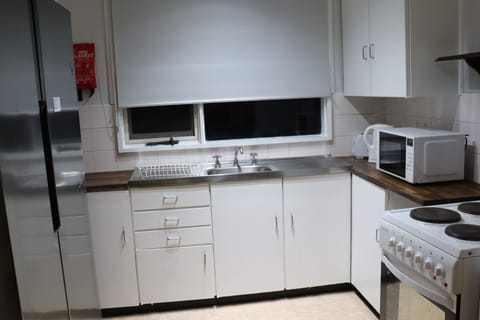 Fridge, microwave, cookware/dishes/utensils