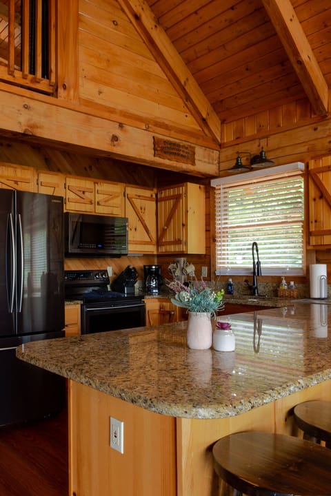 This space welcomes you with a countertop and modern appliances.