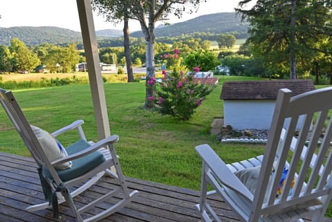 Five rocking chairs on the porch provide a serene place to enjoy morning coffee