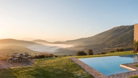 An infinity pool, sun loungers