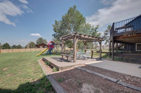 1 acre lot to play and enjoy. Lower patio set and pergola is yours to enjoy exclusively. The play equipment is shared and upper patio is for upstairs guests. Waiver to be completed to play on equipment.
