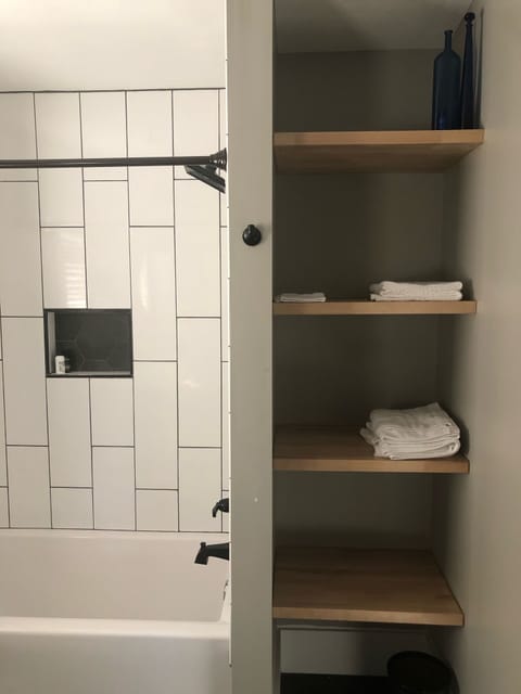 Combined shower/tub, hair dryer, towels, soap