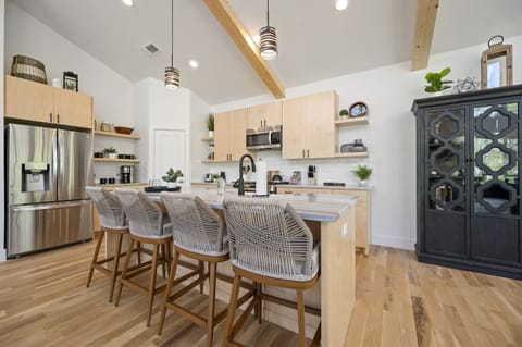 Kitchen: Modern charm awaits! Cook up memories in this stylish, well-equipped kitchen space.