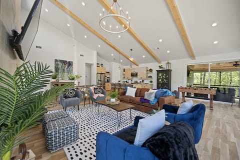 Living Room: Bright space with sleek design, perfect for game nights and laughter with loved ones!