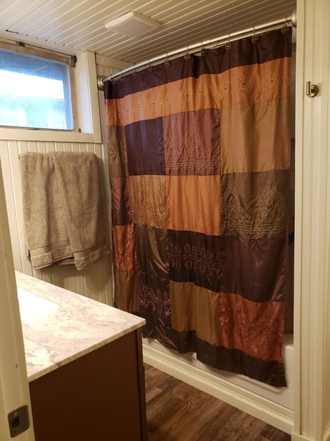 Combined shower/tub, hair dryer, towels, toilet paper