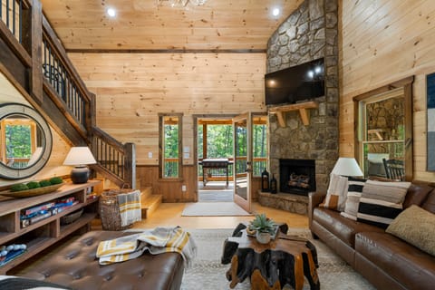 Welcome to Red Oak Retreat. TV room, with fireplace with lots of seating. 