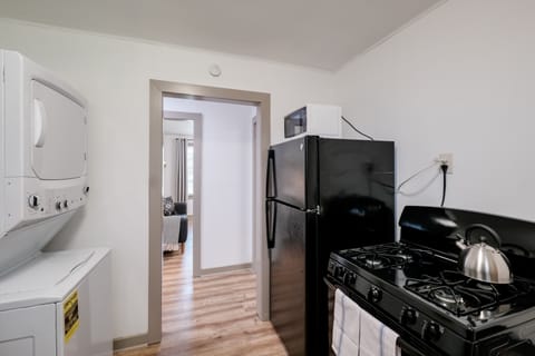 Spacious kitchen area where you can cook meals while staying in the unit. 