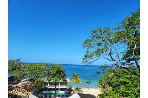 On the beach, sun loungers, beach towels