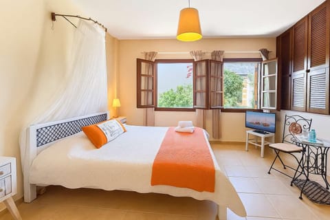 Bedroom with Double Bed and Window View – Bright and airy sleeping space.