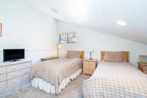 Bedroom 2 features two twin beds.