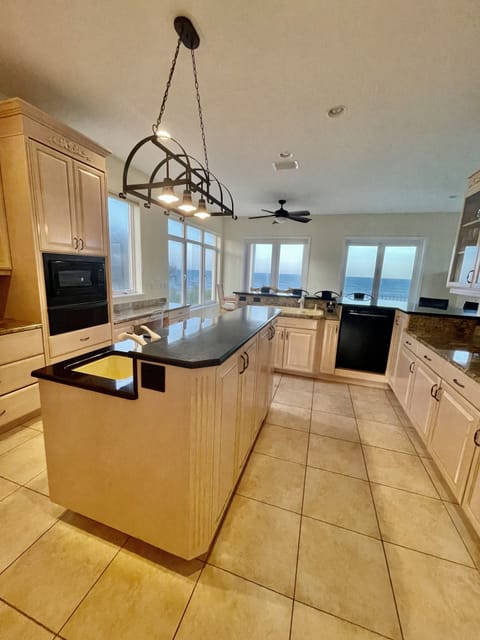 Kitchen features 2 sinks, bar area & plenty of space for big family gatherings 