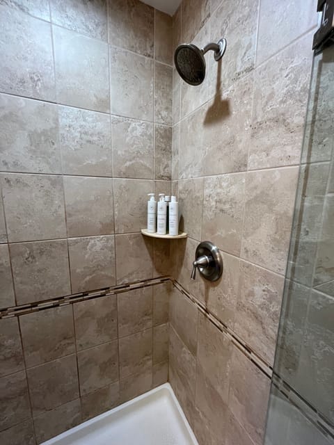 Combined shower/tub, hair dryer, towels, soap