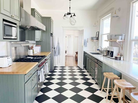 The Edna Estate kitchen is outfitted with everything a cook could want! We provide all the cooking supplies needed: our cabinets are stocked with all the kitchen basics, even a gourmet Wolfe stove.