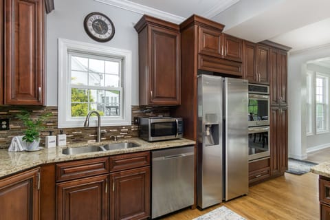 The kitchen is fully equipped with stainless steel appliances and everything you need to prepare gourmet meals.