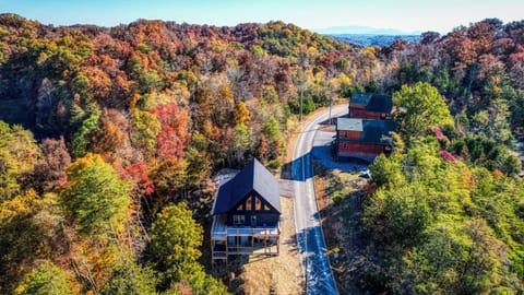 Surrounded by fiery fall foliage, our cabin is a true autumn haven.