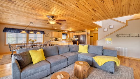 An open living room/kitchen/dining room concept so families can eat, play, relax