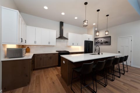 Kitchen fully stocked with cookware and bakeware.