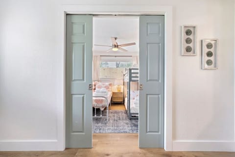 This bedroom has a queen bed & a full size bunk bed