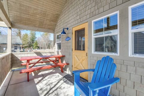The bungalow patio features a picnic table, two chairs and a BBQ.