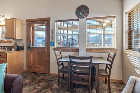 Quaint dining area with seating for three.