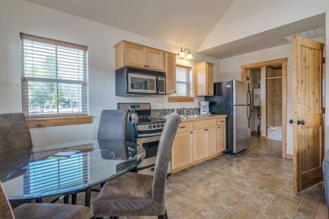 Dining area that seats 4 and furnished kitchen with cooking essentials.