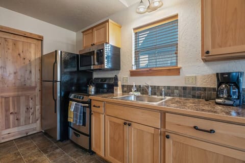 Adorable delightfully detailed kitchen.