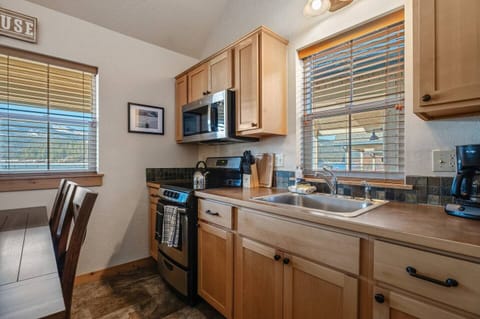 Cute kitchen with the basic cooking equipment.