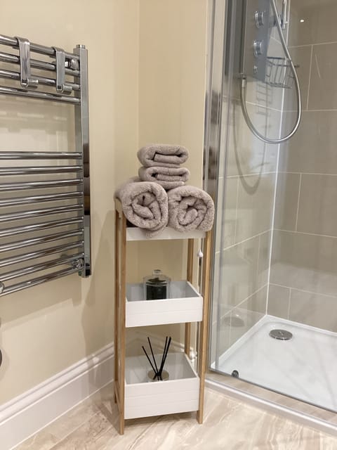 Shower, eco-friendly toiletries, hair dryer, towels