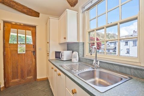 Old Post Cottage Coniston kitchen with view over beck