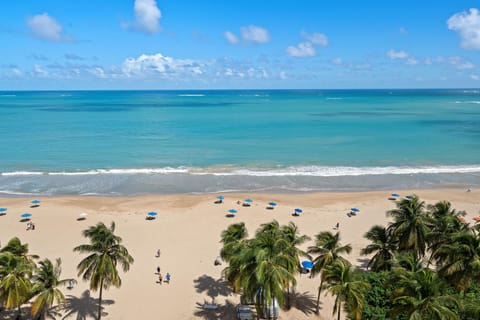 On the beach, sun loungers, beach towels