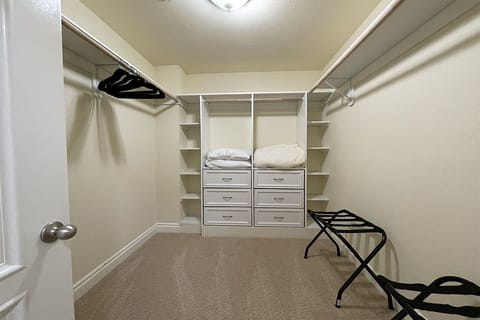 Spacious closet in master bedroom.