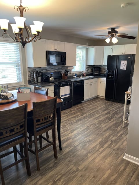 Fully stocked kitchen with dining area.