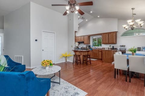 Spacious open-concept kitchen and living area with plenty of seating, natural light, and inviting charm.