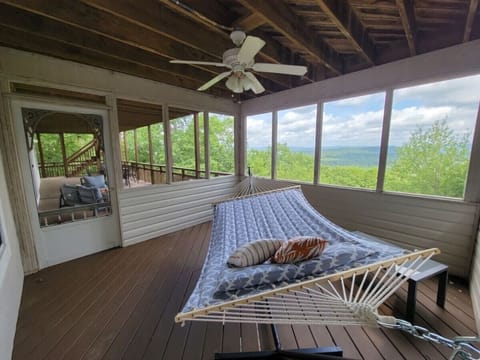 Unwind in the hammock and take in the fresh air from this screened-in porch with stunning views and a peaceful breeze