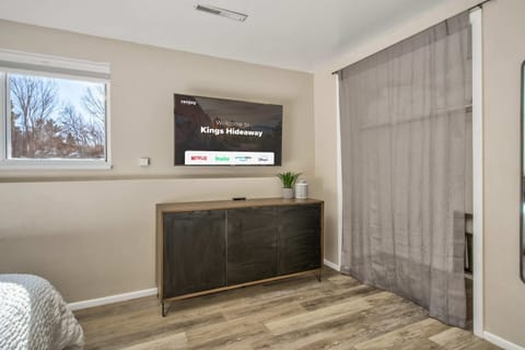 Relax in the king-size bedroom with a Smart TV!