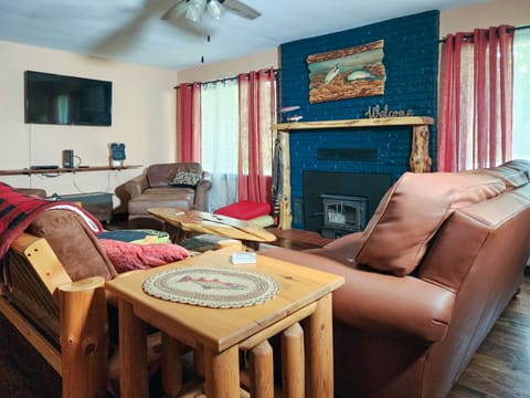 The comfy living room has plenty of seating to relax after a long day of fun.