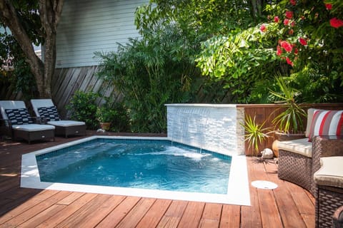 Enjoy the soothing sounds of the waterfall as you relax by the pool at 'The Conch Chateau'.