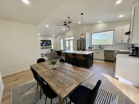 Dining room looking into the kitchen and living room.