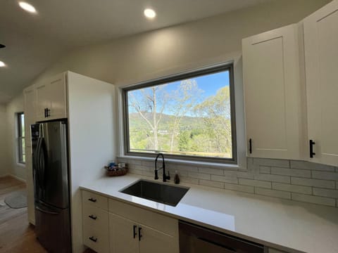 Cleaning dishes with a view.