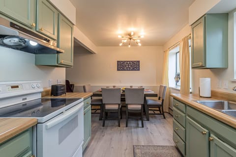 Compact yet fully equipped! This kitchen has all the essentials and flows effortlessly into the dining space.