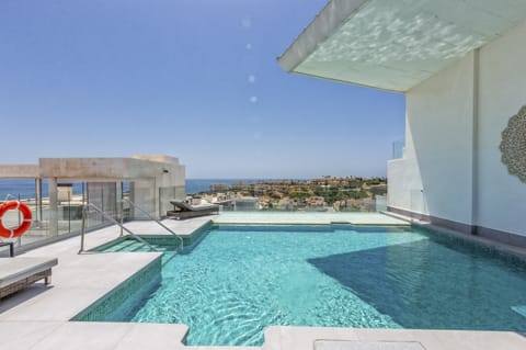 Indoor pool, a rooftop pool, sun loungers