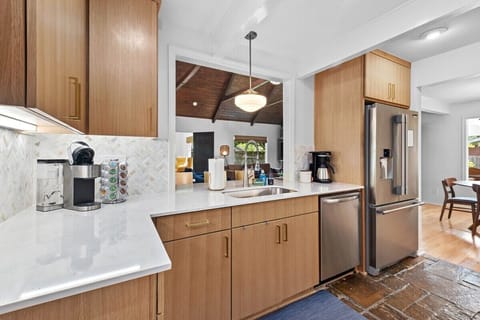 Our kitchen is complete with gorgeous natural stone floors, tons of built-in storage and state-of-the-art amenities.