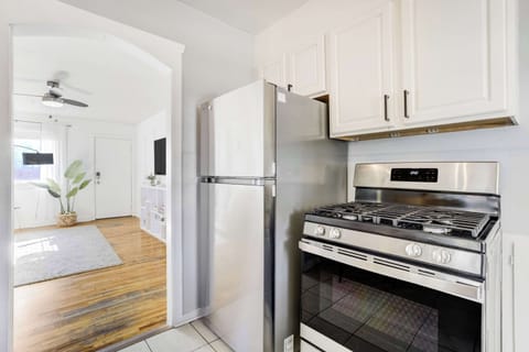 Enjoy a seamless flow from the fully stocked kitchen into the bright living area—perfect for cooking and connecting after a day in Old Colorado City.