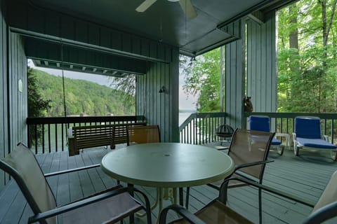 Open air covered porch on bottom floor leading out to the lake