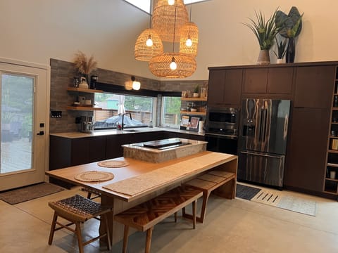 Open concept kitchen with table that can seat 8