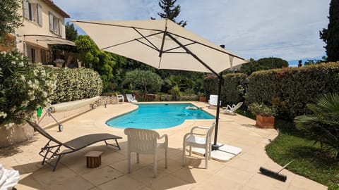 A heated pool, sun loungers