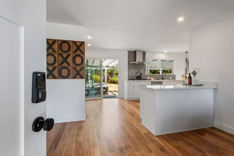 Entryway and view of the tic-tac-toe wall art board