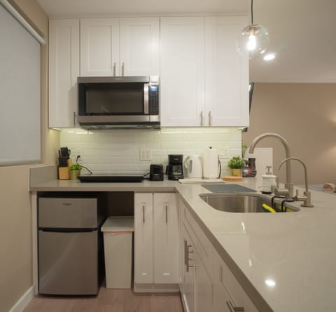 Kitchenette w/ microwave, fridge, cooktop, toaster, coffee maker, filtered water
