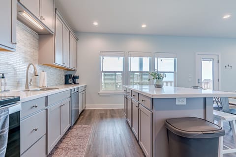 Tons of beautiful granite counterspace so you can hang out with everyone in the open floorplan while you prepare a delicious meal together. Drip and K-cup coffee pots, press pot & tea kettle available.