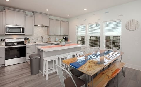 Watch the waves as you eat and cook from the well-stocked kitchen and open dining space.